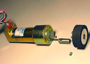 A 10-32 setscrew binds wheel, bushing and motor